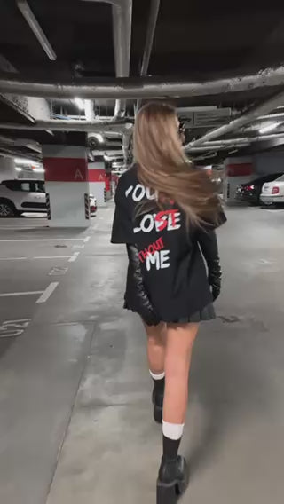 girl in video with tshirt and tattoos